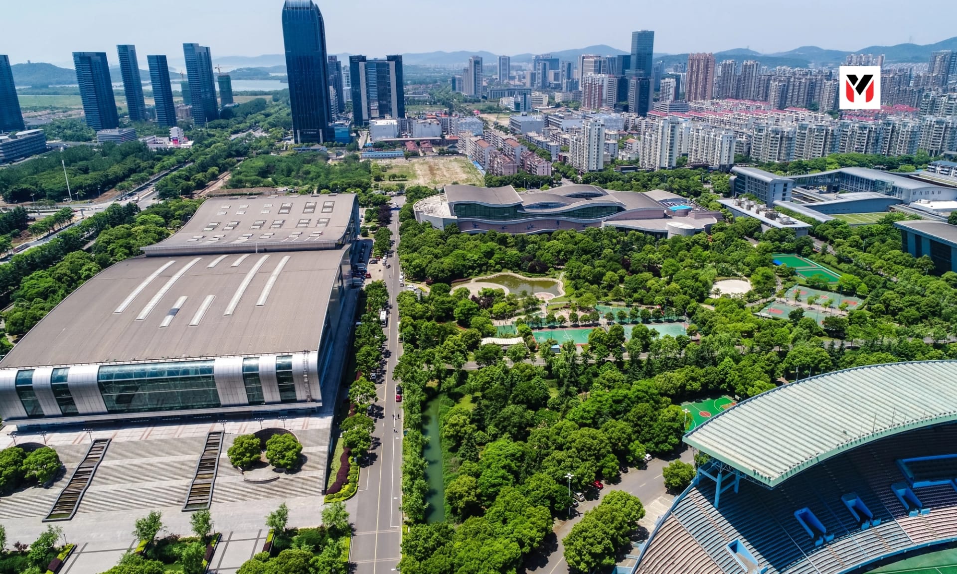 Aerial view of a modern warehouse park beside a highway